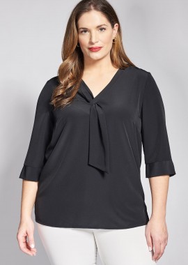 - Μπλούζα ζωρζέτα με γραβάτα και τρουακάρ μανίκια.