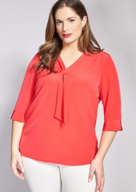 - Μπλούζα ζωρζέτα με γραβάτα και τρουακάρ μανίκια.